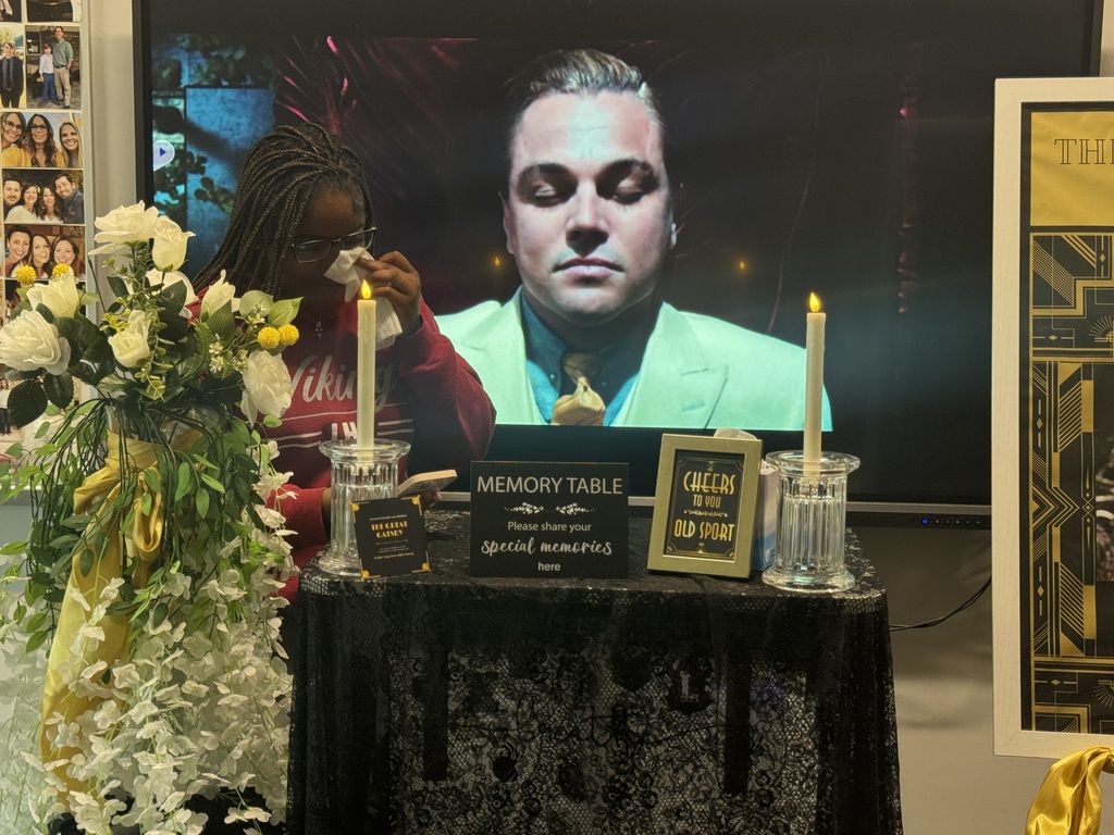 Student shedding tears as she delivers an eulogy atthe Gatsby celebration
