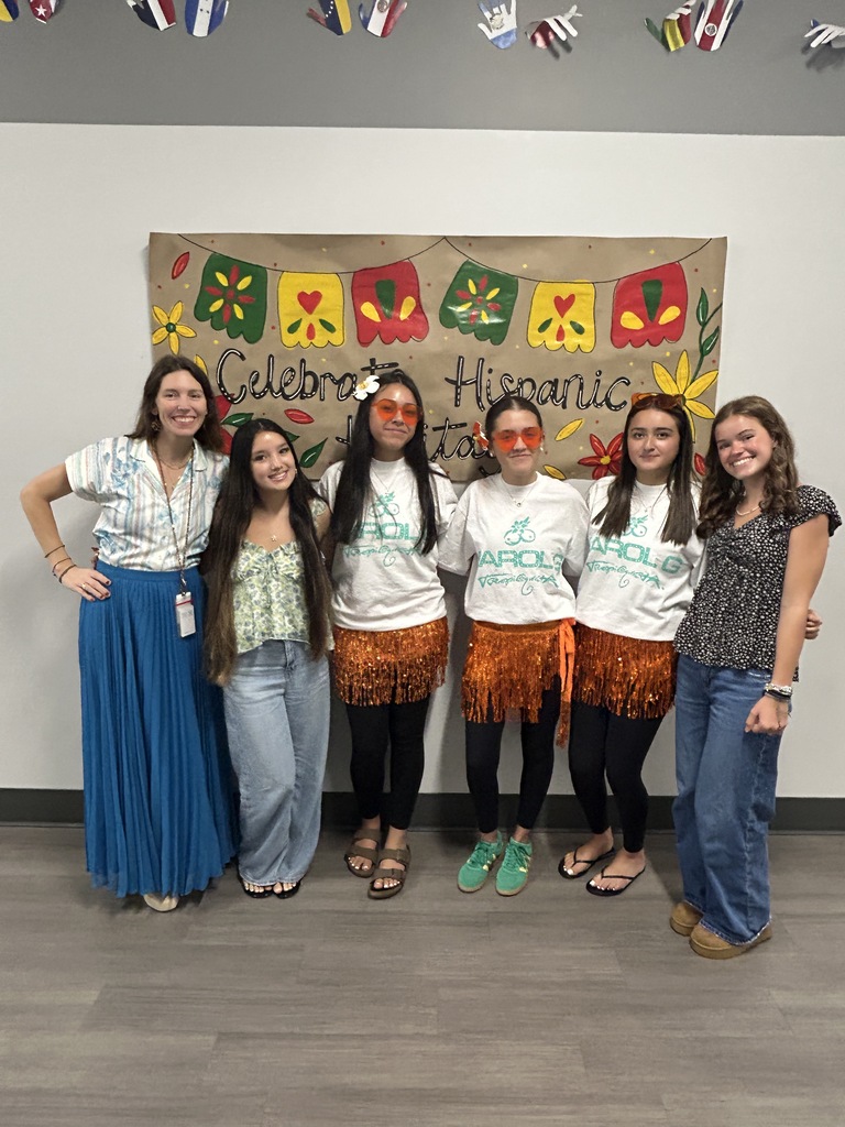 Teacher and students dressed for Tropicoqueta day