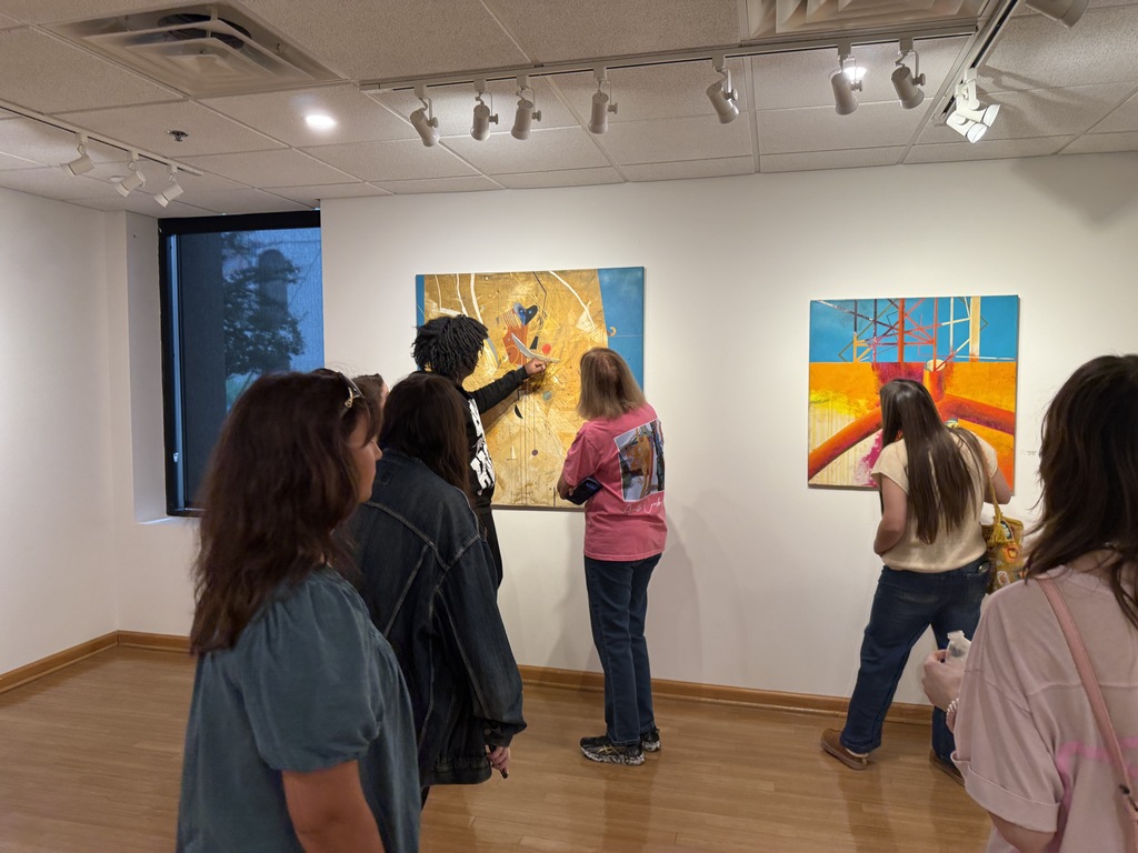 Students viewing art exhibits