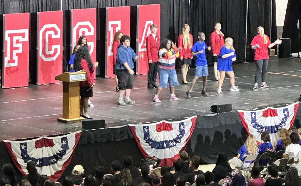 Students on stage with FCCLA banner behind them