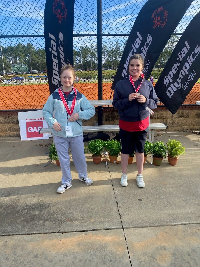 Two students with the medals