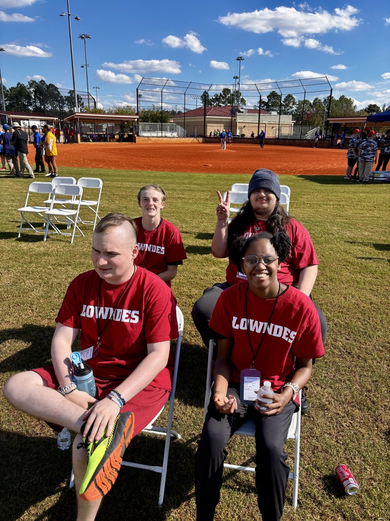 4 students taking a water break and waiting to participate