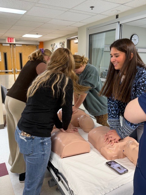 Students practicing chest compressions