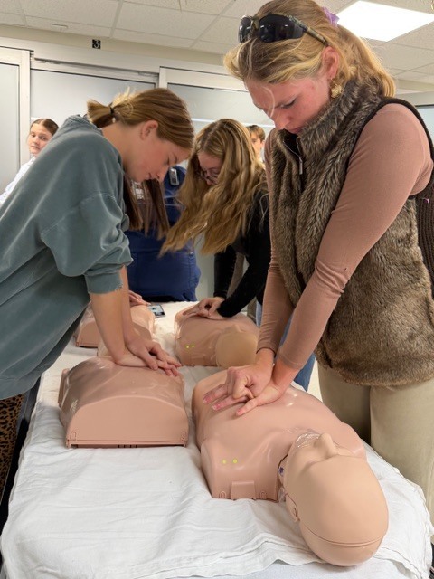Students practicing chest compressions