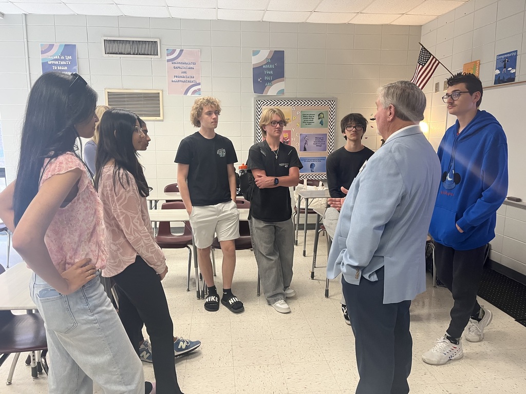 Students having a conversation with Chairman Slaughter