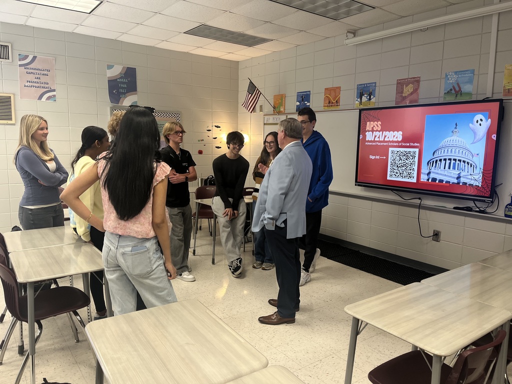 Students having a conversation with Chairman Slaughter