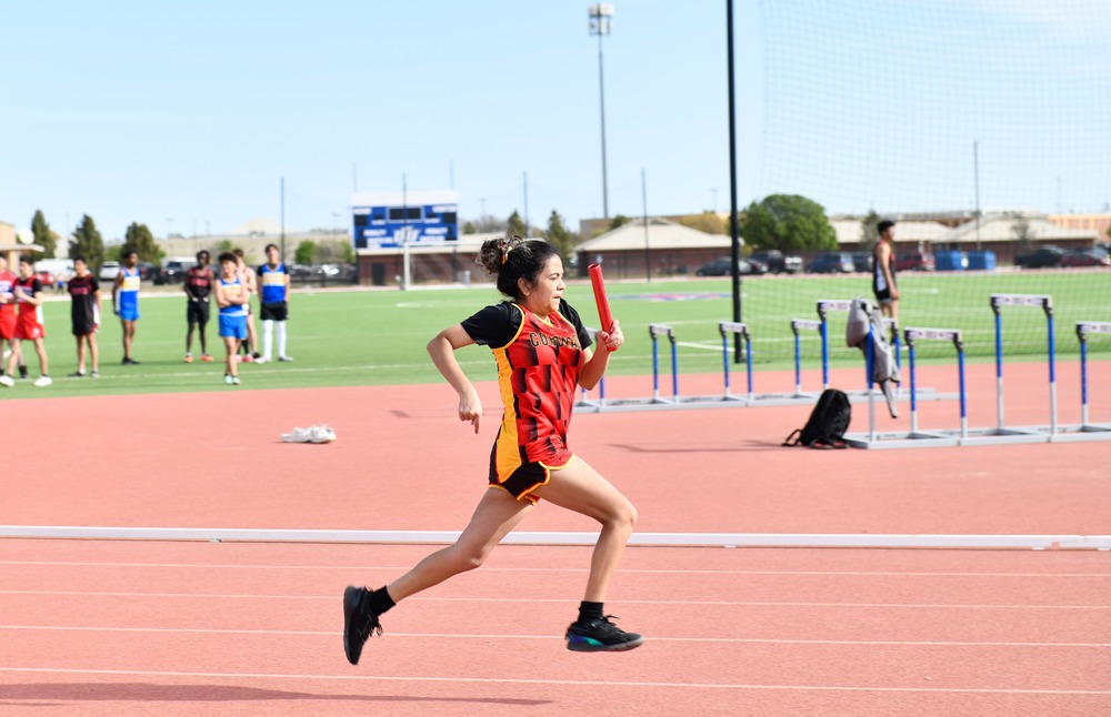 girl relay runner