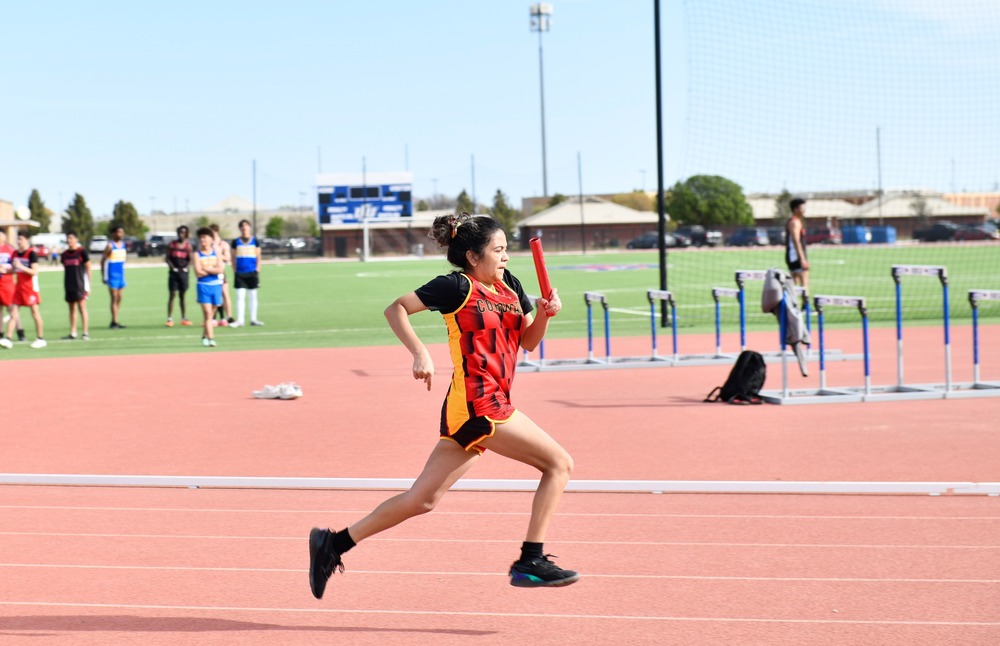 girl relay runner