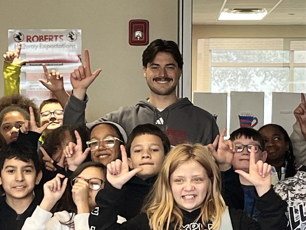 Tech football player with students 