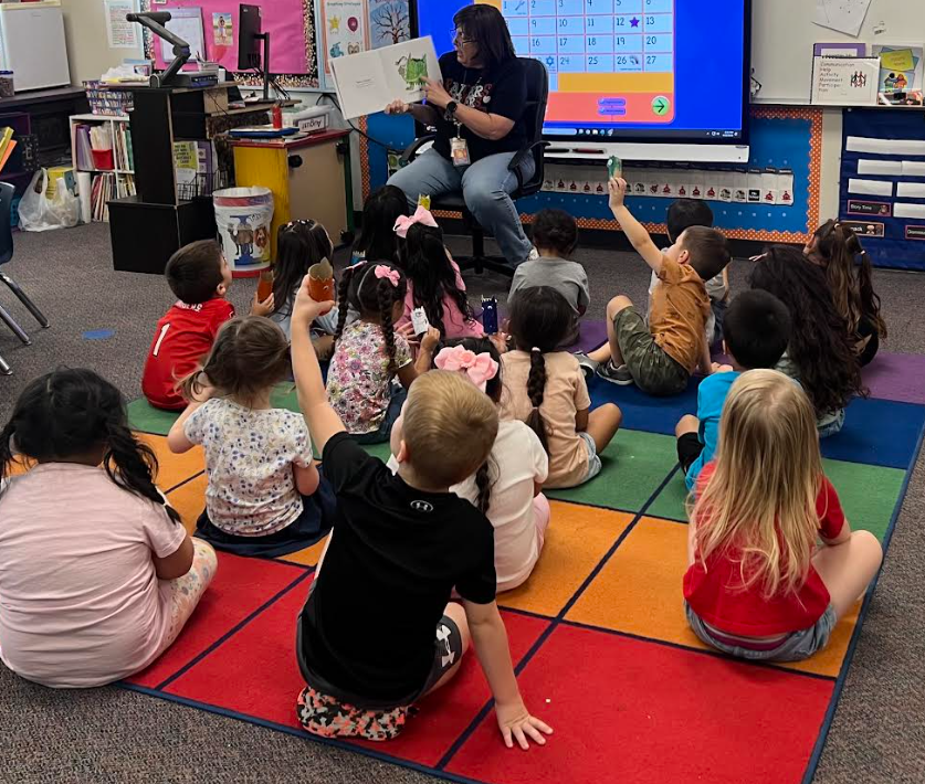 Mrs. Perez's class listening to a story