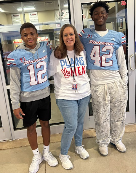 MHS Football Players greeting students and staff