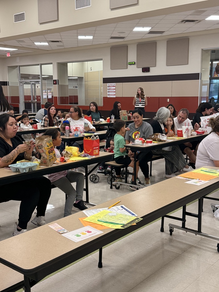 cafeteria full of parents and students at the kinder lunch and learn