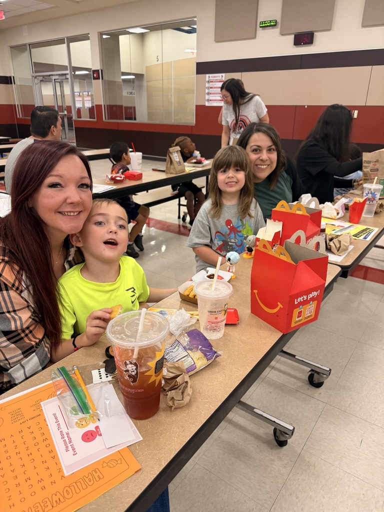Family eating lunch together in the cafeteria