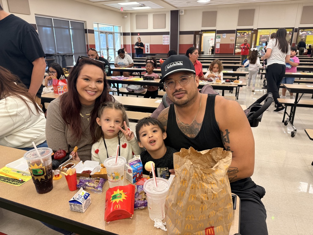 Family eating lunch together in the cafeteria