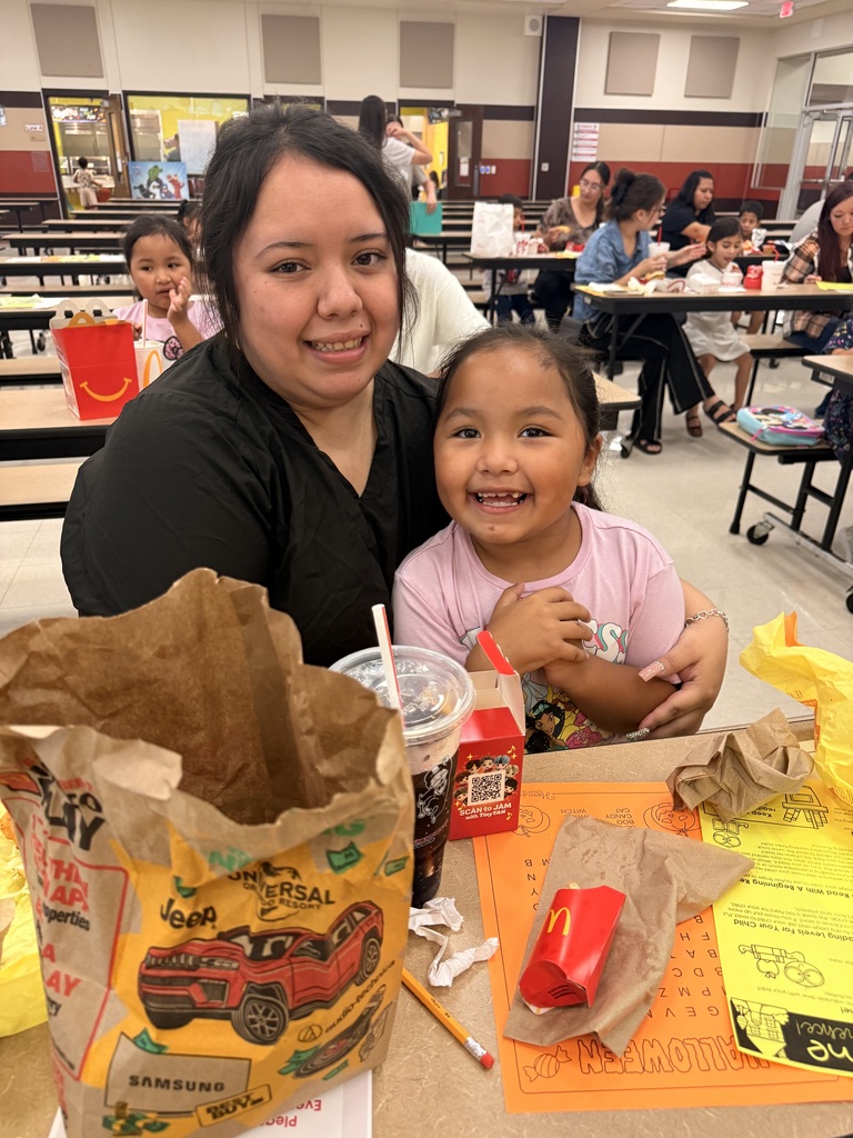 mom and daughter eating lunch together in the cafeteria