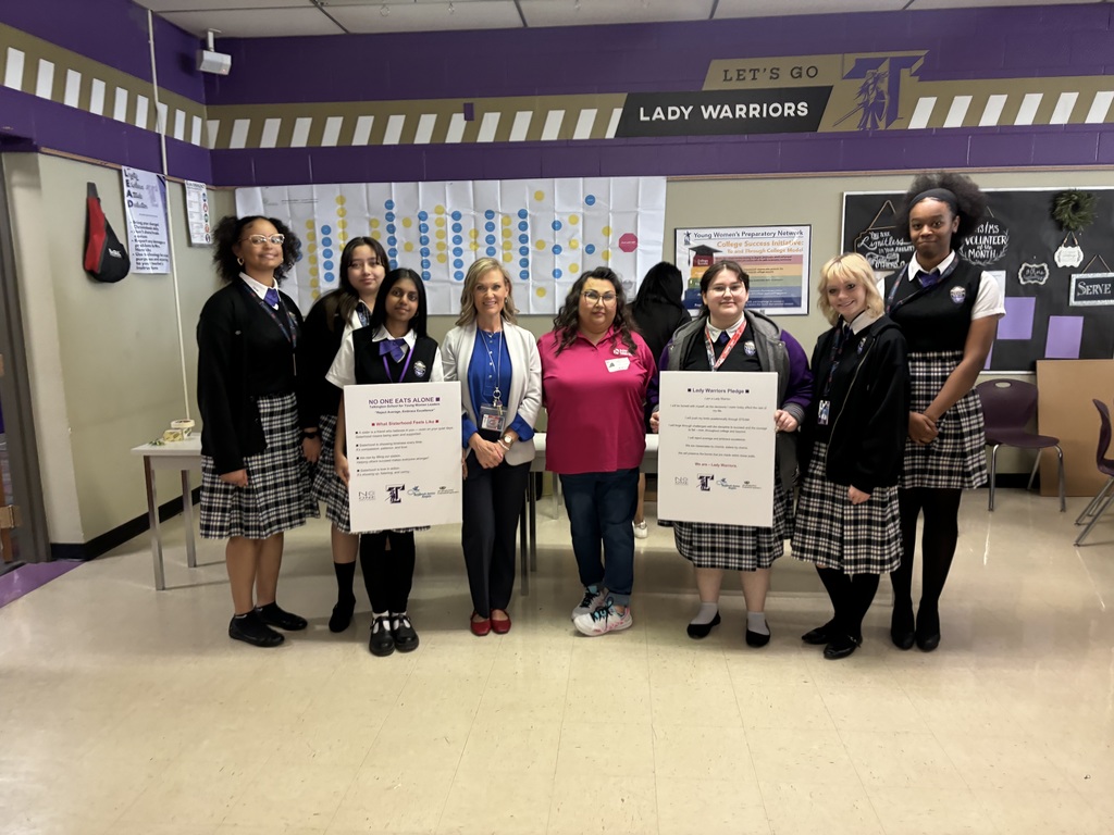 mentees with the signs donated by our community partners