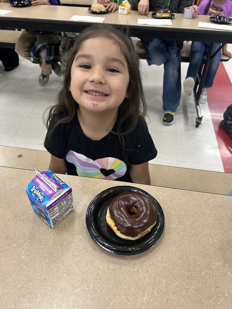 student eating a donut