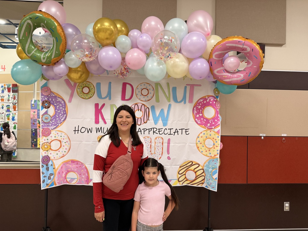  parents and child at the donuts with grownups event