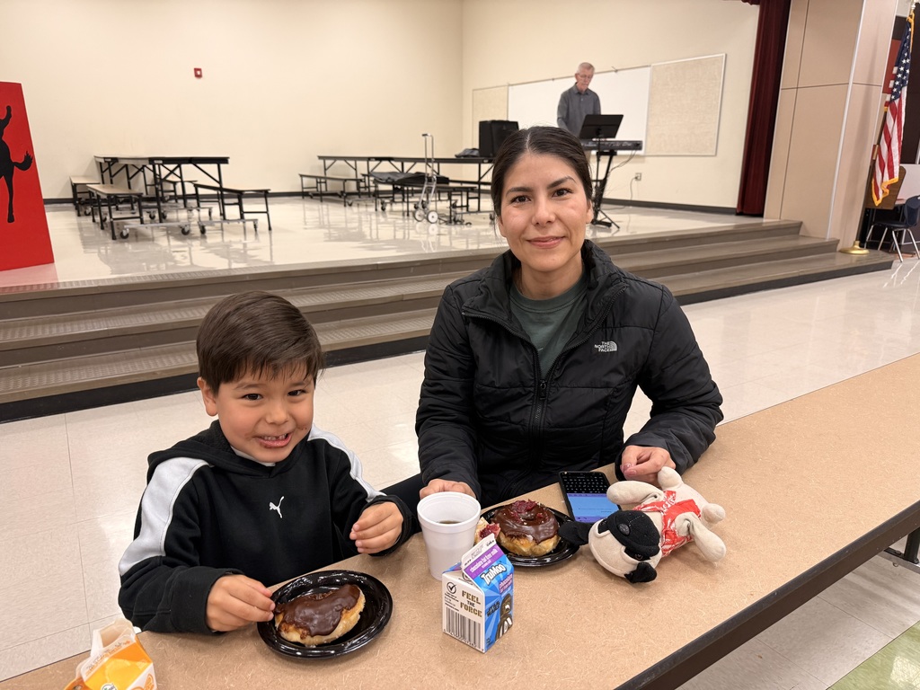  parents and child at the donuts with grownups event