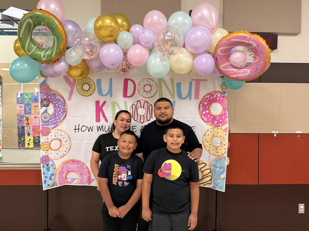  parents and child at the donuts with grownups event
