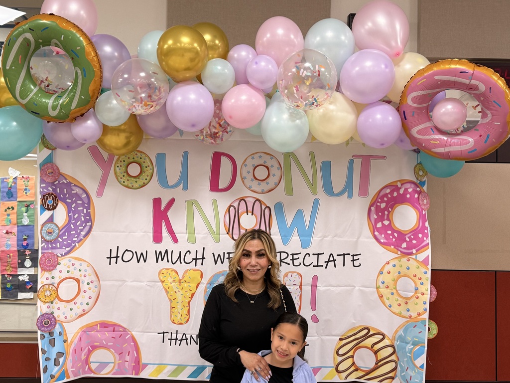  parents and child at the donuts with grownups event