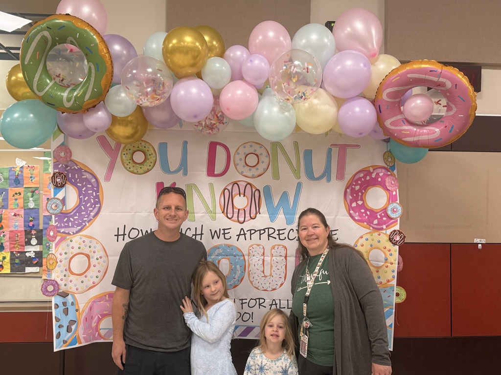  parents and child at the donuts with grownups event