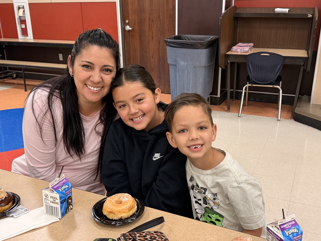  parents and child at the donuts with grownups event