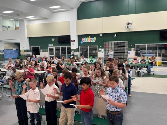 NEHS Inductees reciting their oath