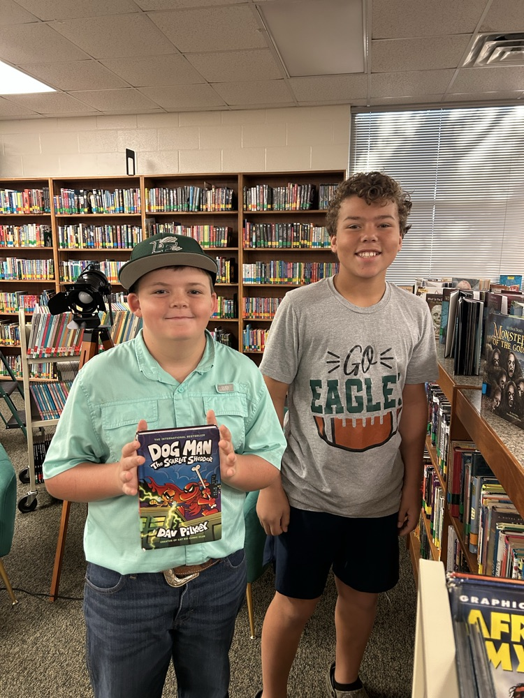 student with library books