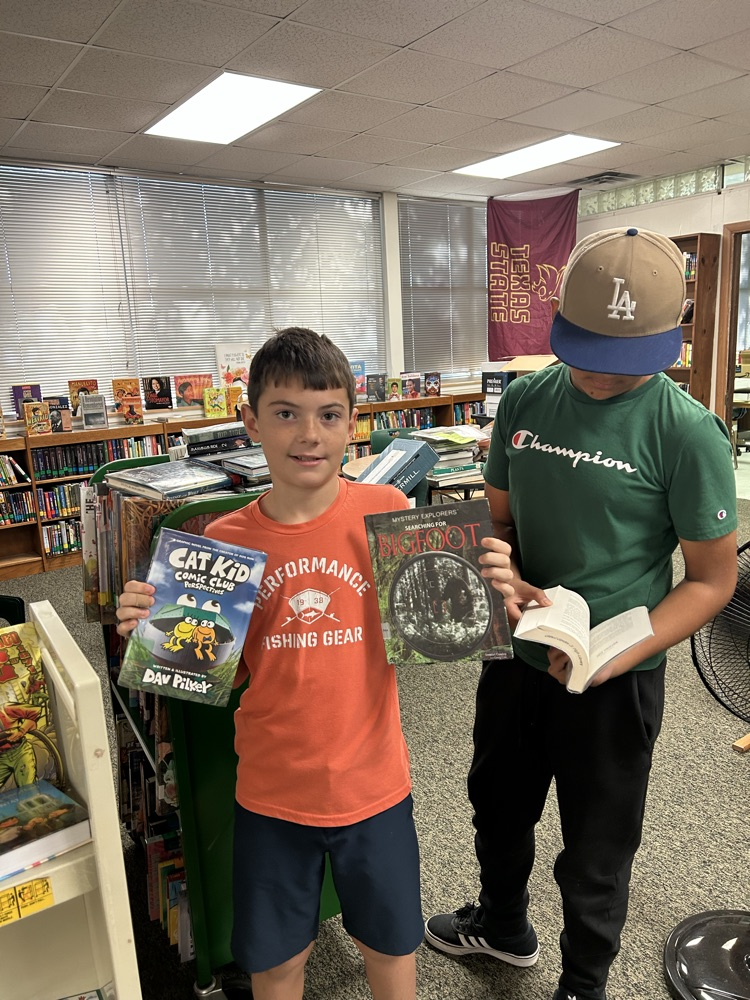 student with library books