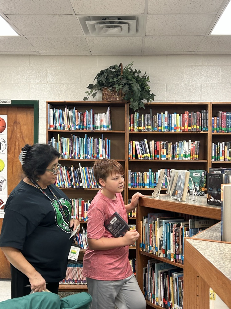 student with library books