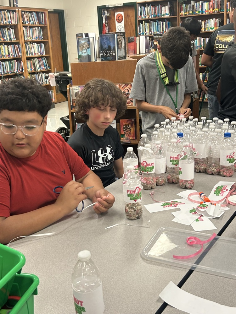 student making pink out items