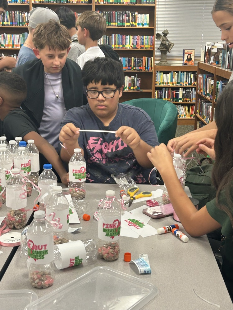 student making pink out items