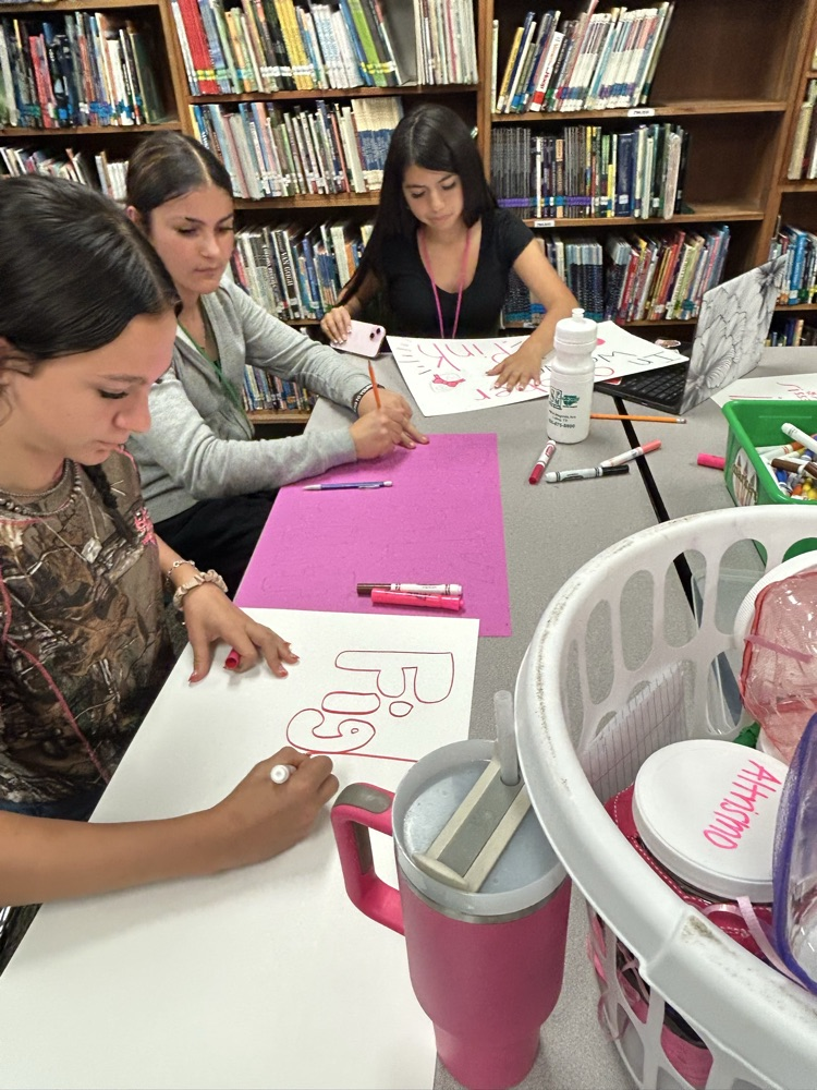 student making pink out items