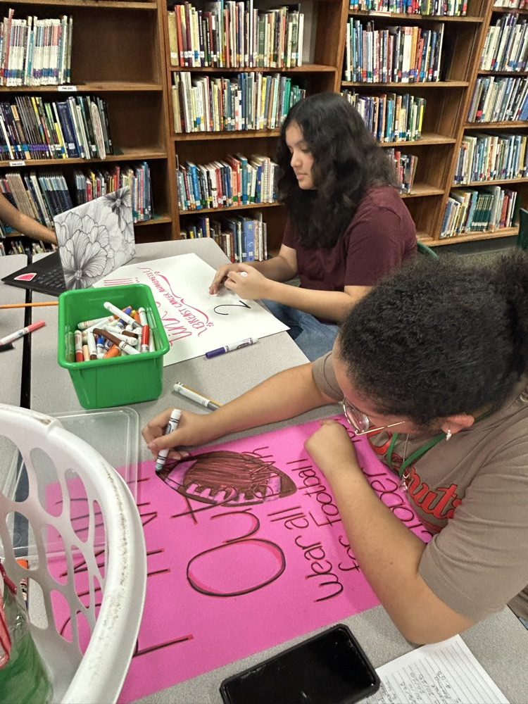 student making pink out items