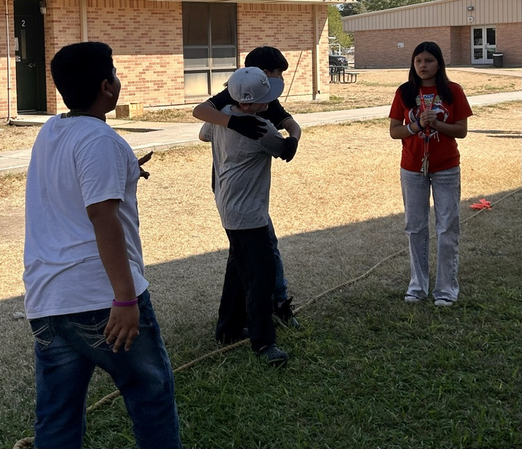 students playing tug of war