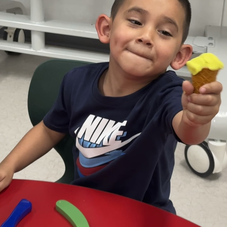 student showing off his ice cream