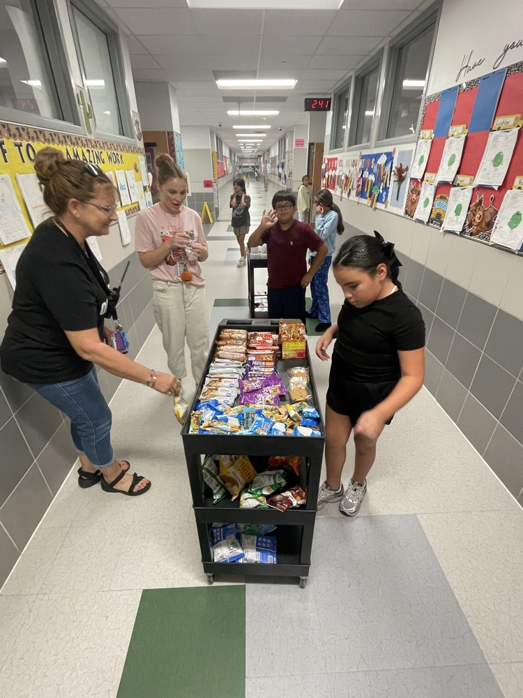 Student Council Officers bringing the treats to teachers!