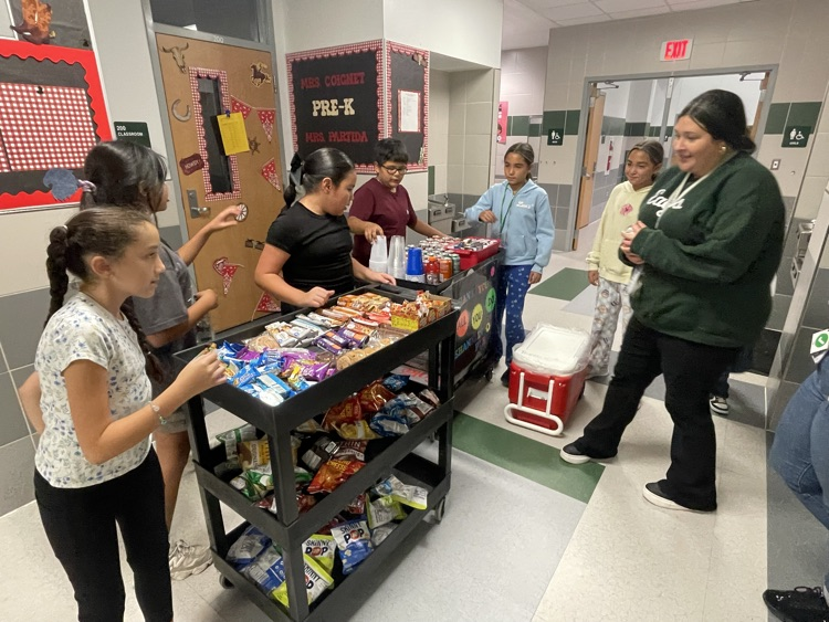 Student Council Officers bringing treats to teachers!
