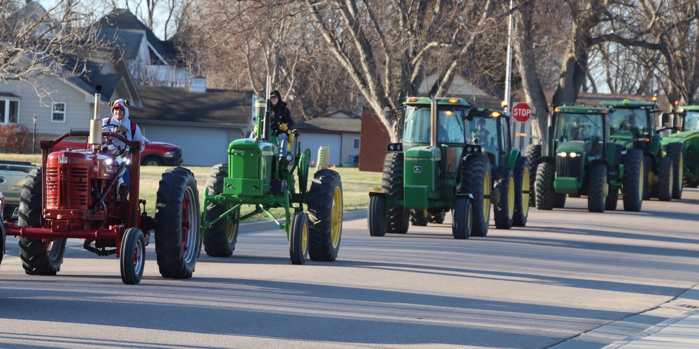 Students driving tractors
