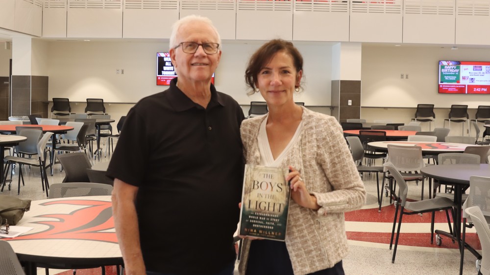 Author Nina Willner poses with her book