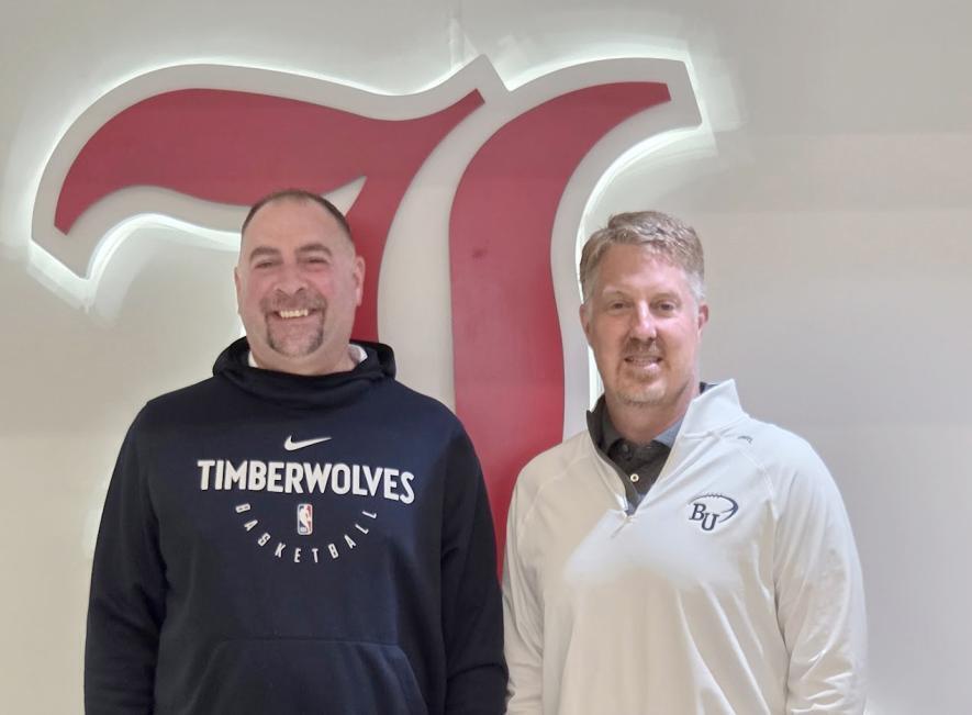 Principal Phelps and Johnson pose for a picture