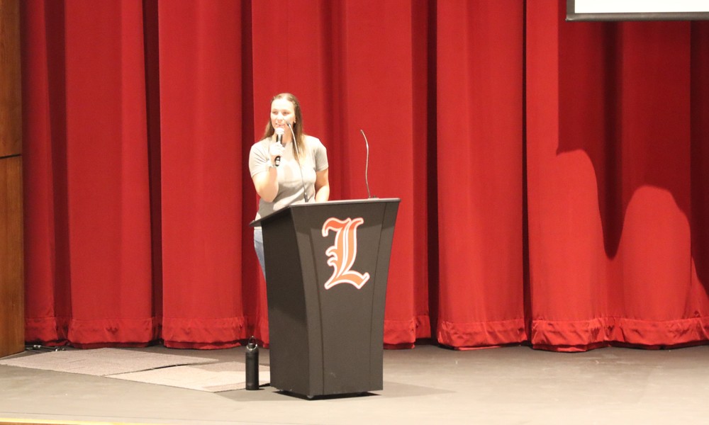 Miller speaking during assembly