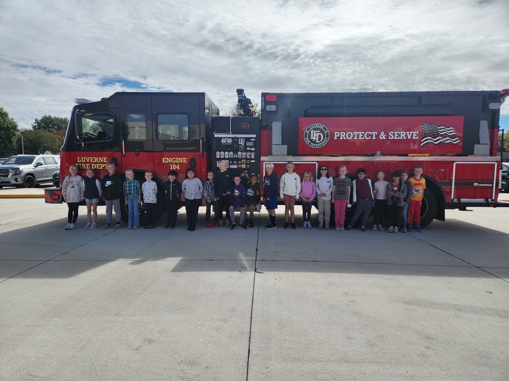Students listen as local volunteer firefighters explain how to keep yourself safe from fires as well as show all of their firefighter tools!