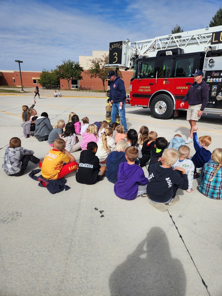 Students listen as local volunteer firefighters explain how to keep yourself safe from fires as well as show all of their firefighter tools!