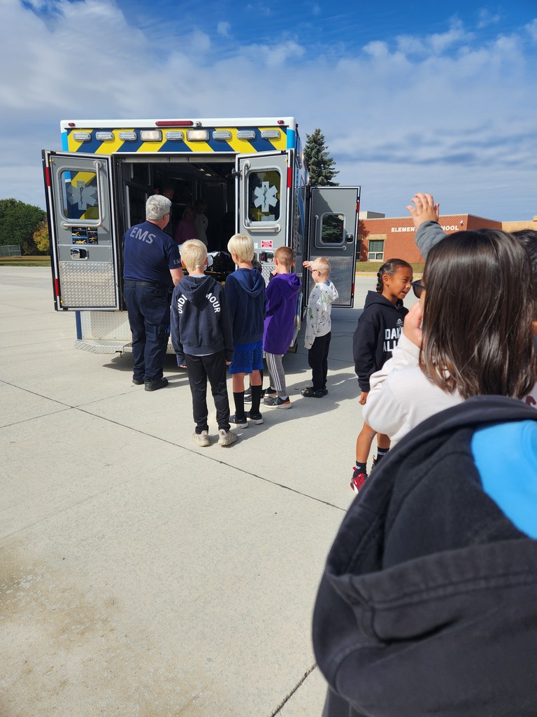 Students listen as local volunteer firefighters explain how to keep yourself safe from fires as well as show all of their firefighter tools!