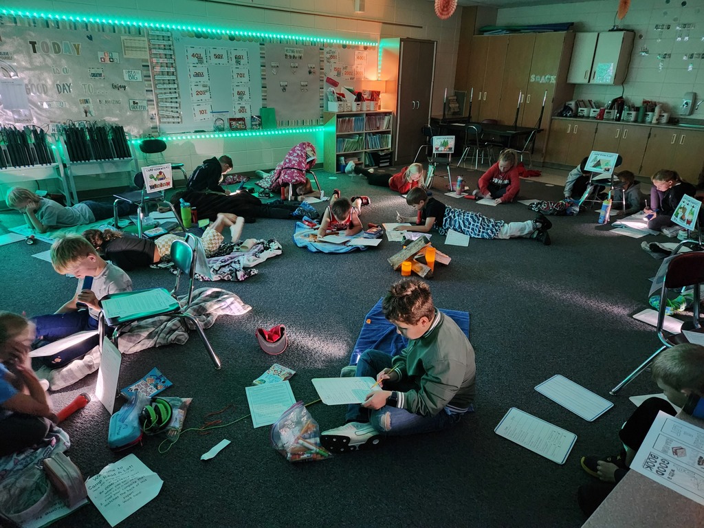 Camping Day reading with flashlights.