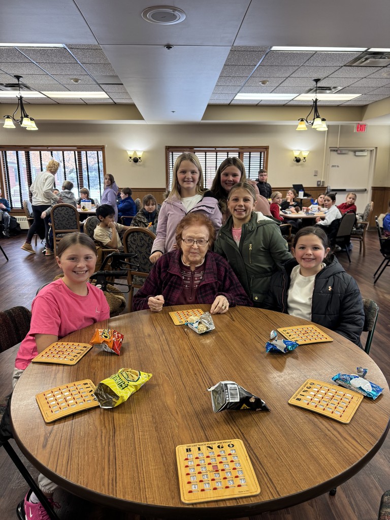 4th graders playing Holiday Bingo and visiting with residents at the Mary Jane Brown Home.