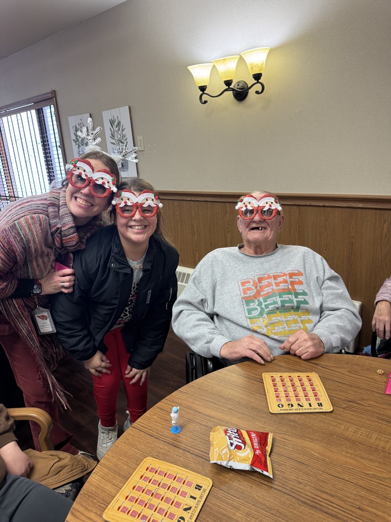 4th graders playing Holiday Bingo and visiting with residents at the Mary Jane Brown Home.