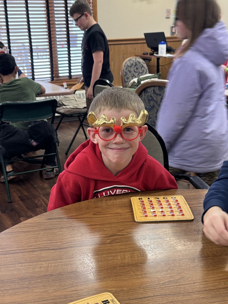 4th graders playing Holiday Bingo and visiting with residents at the Mary Jane Brown Home.